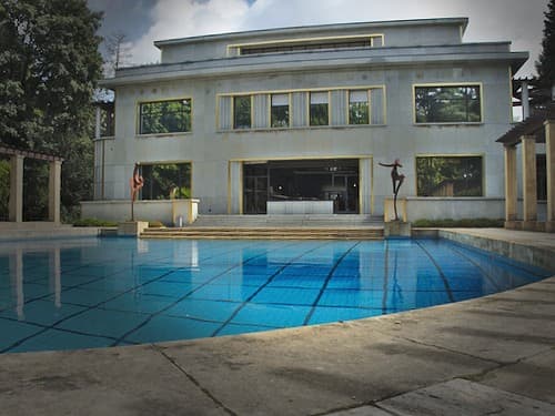 View of the swimming pool with the rear of the villa in the background