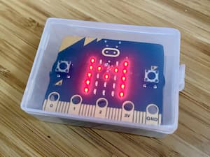 Micro:bit in a box showing the letter M