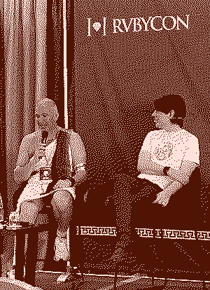 People two people talkin on stage @ Rubycon